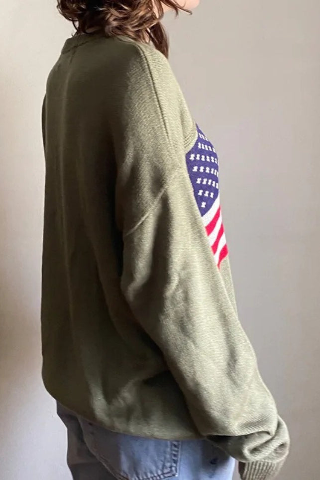 Lockerer Strickpullover mit Stehkragen und Retro Flaggenmotiv
