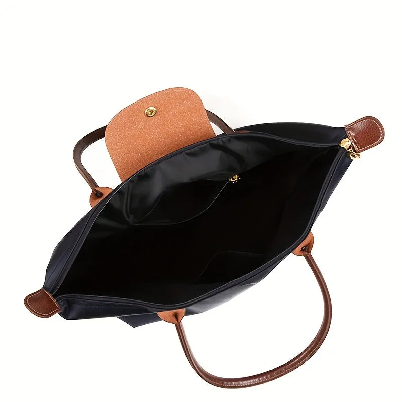 Elegante Damen Umhängetasche mit Schulterriemen und goldfarbenen Details