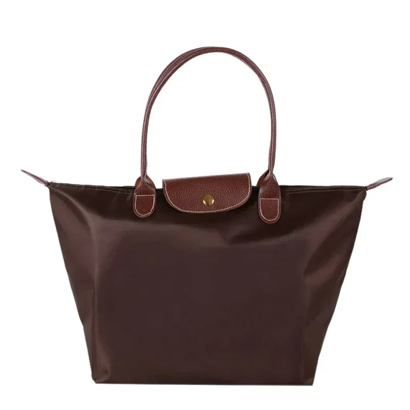 Elegante Damen Umhängetasche mit Schulterriemen und goldfarbenen Details